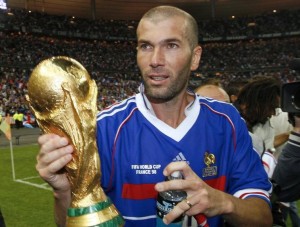 France's Zinedine Zidane holds the World Cup trophy after an exhibition soccer match in Saint Denis
